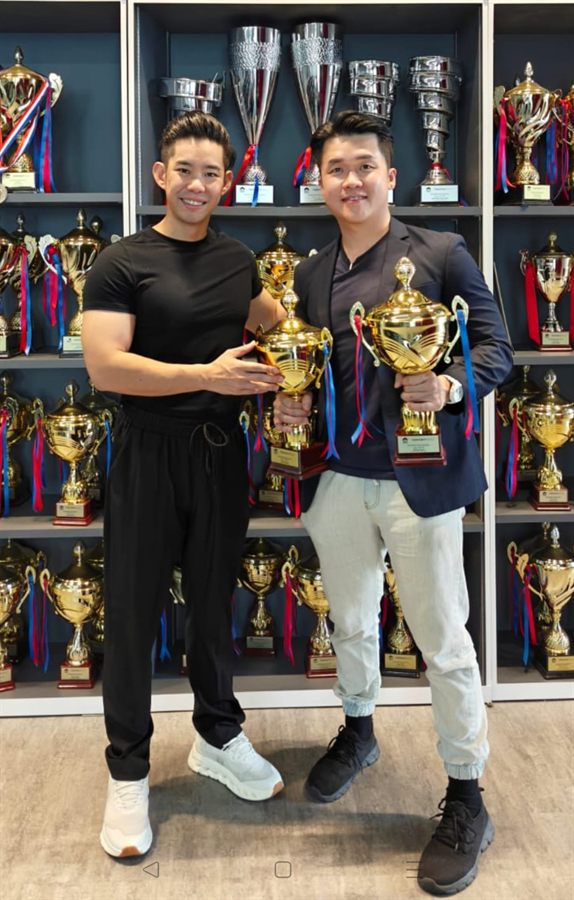 Andrew Chua celebrating his award wins